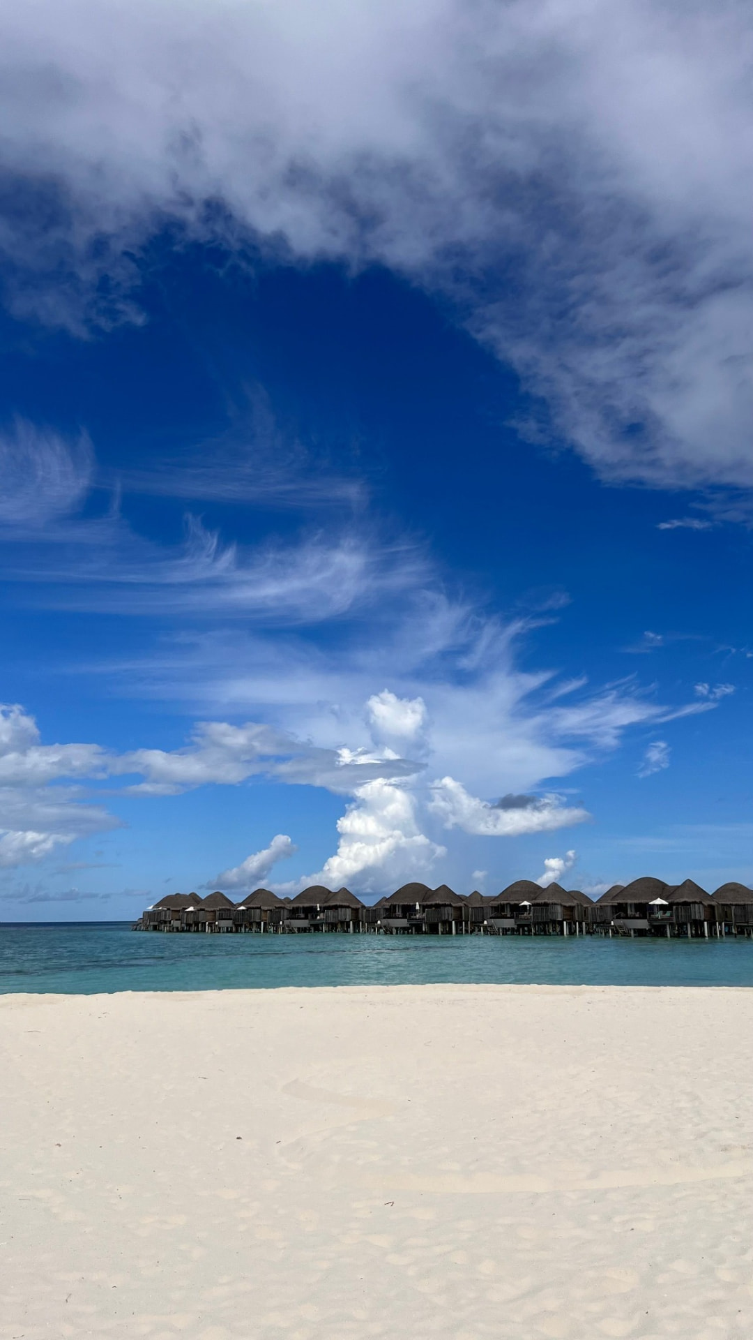 Beach and overwater villas at Medhufushi