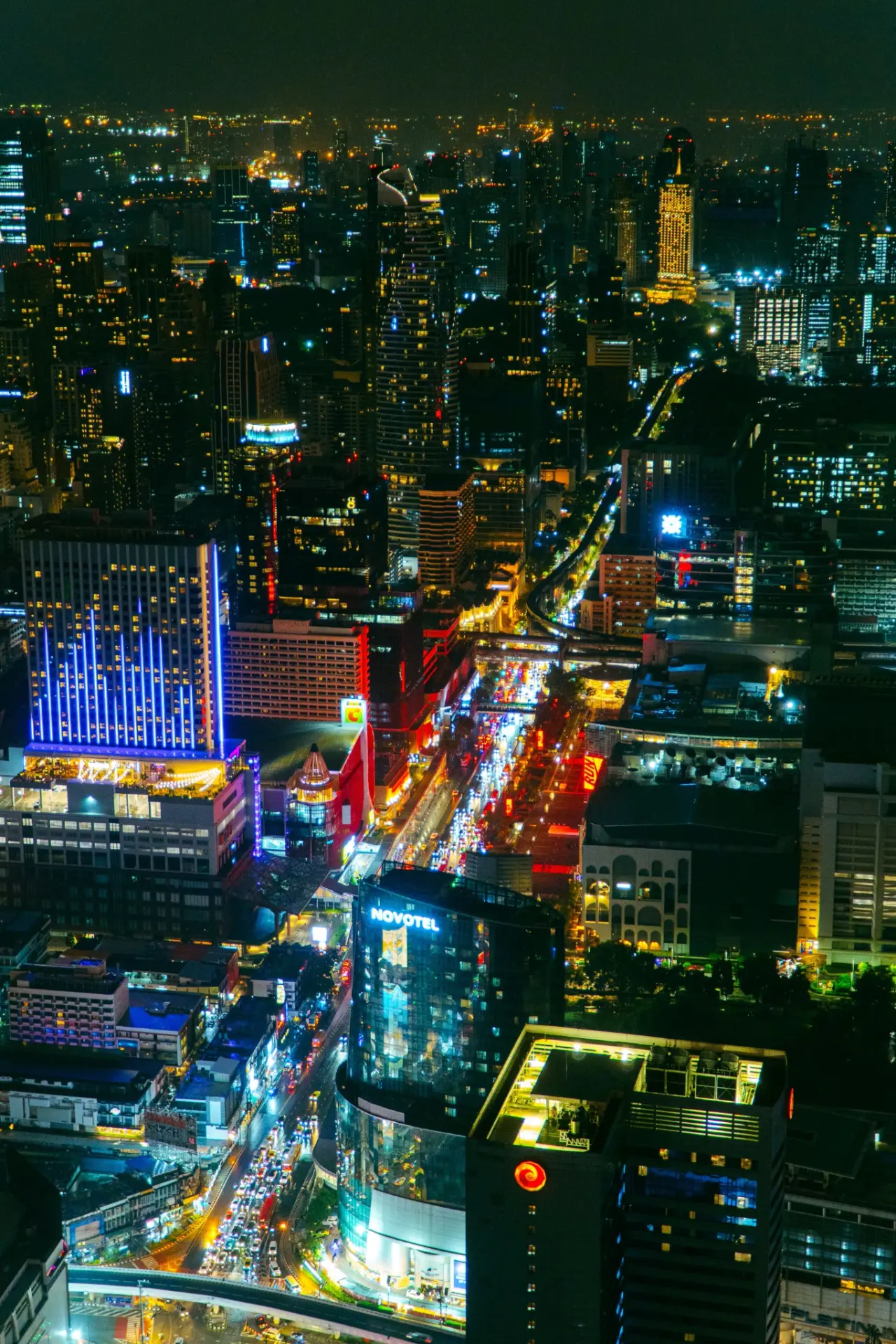 Temple scene glowing at night in Thailand